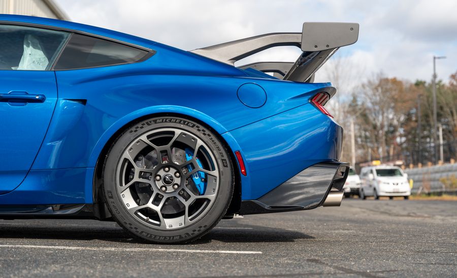 The Mustang GTD's flank, the blue paint mirroring the sky