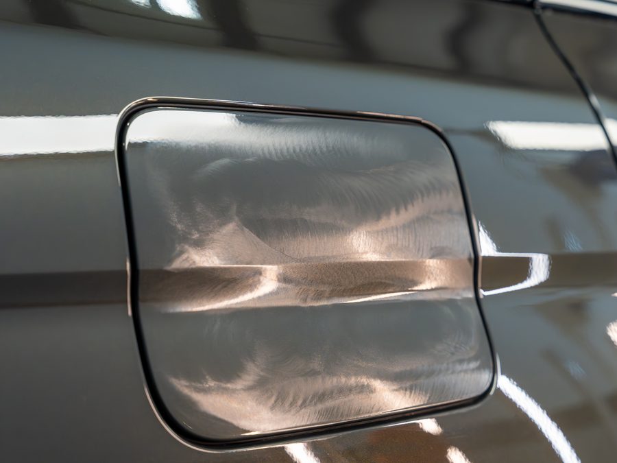 A BMW fuel door partway through correction