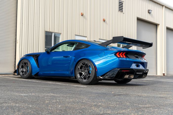 A blue Ford Mustang GTD from the rear three quarter