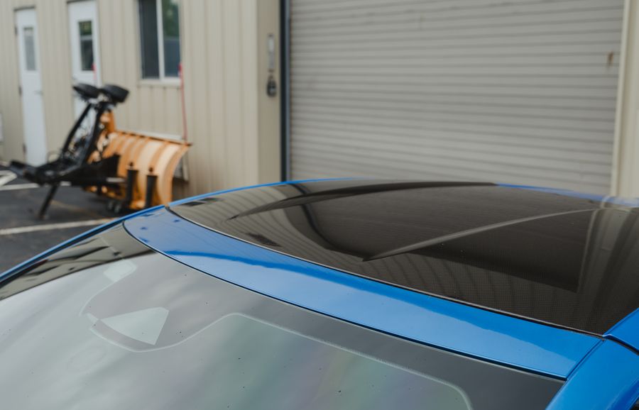 The Corvette's dark tinted roof glass